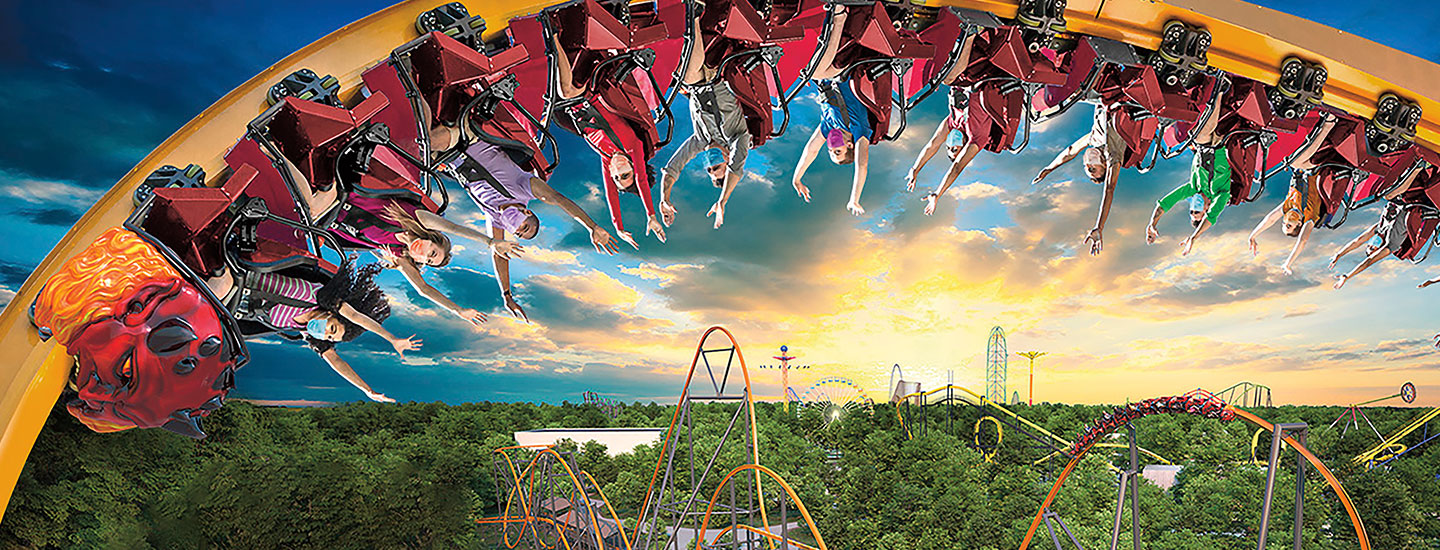 People riding an upside-down rollercoaster